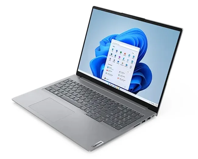 Overhead shot of Lenovo ThinkBook 16 Gen 6 laptop showing display with Windows 11 Start menu, keyboard, & right-side ports & slots.